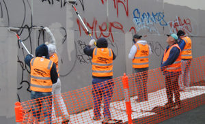 Graffiti offenders removing graffiti in Victoria